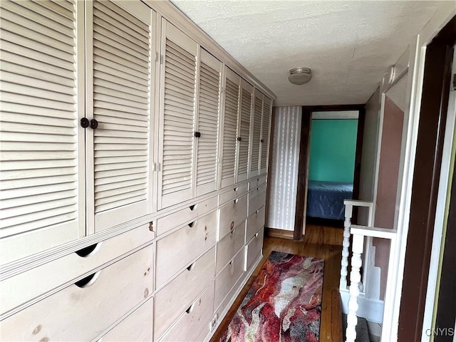 41 Evergreen St, Cortland, NY 13045 - hall featuring wood finished floors and a textured ceiling