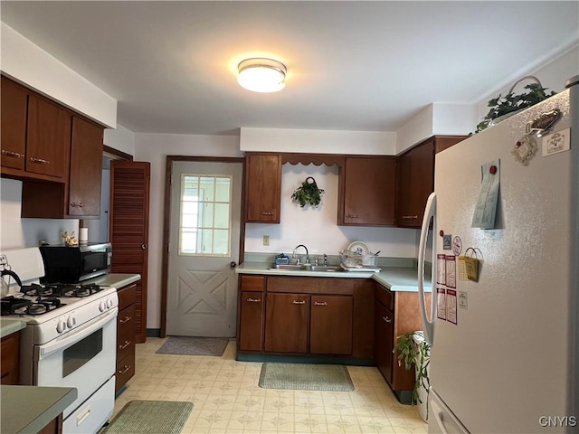 41 Evergreen St, Cortland, NY 13045 - kitchen featuring white appliances, light countertops, and light flooring