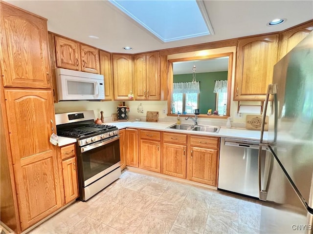 341 N Hoopes Ave, Auburn, NY 13021 - kitchen with appliances with stainless steel finishes, light countertops, recessed lighting, and brown cabinetry