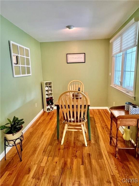 341 N Hoopes Ave, Auburn, NY 13021 - dining space featuring light wood-type flooring and baseboards