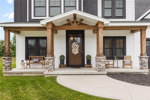 591 Whistlers Cove Ln, Greece, NY 14612 - property entrance featuring covered porch, french doors, and a shingled roof