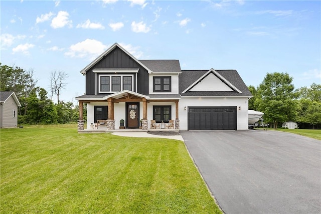 591 Whistlers Cove Ln, Greece, NY 14612 - view of front of property featuring a porch, an attached garage, board and batten siding, a front lawn, and driveway
