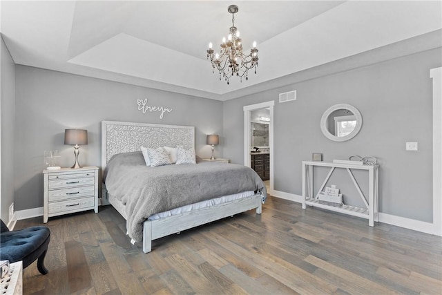 591 Whistlers Cove Ln, Greece, NY 14612 - bedroom with wood finished floors, a chandelier, a raised ceiling, and ensuite bath
