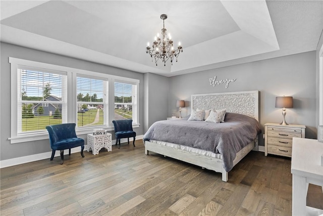 591 Whistlers Cove Ln, Greece, NY 14612 - bedroom with a raised ceiling, a chandelier, and dark wood finished floors