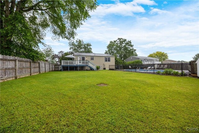 8185 Mantova Dr, Clay, NY 13041 - fenced backyard with a deck and stairway
