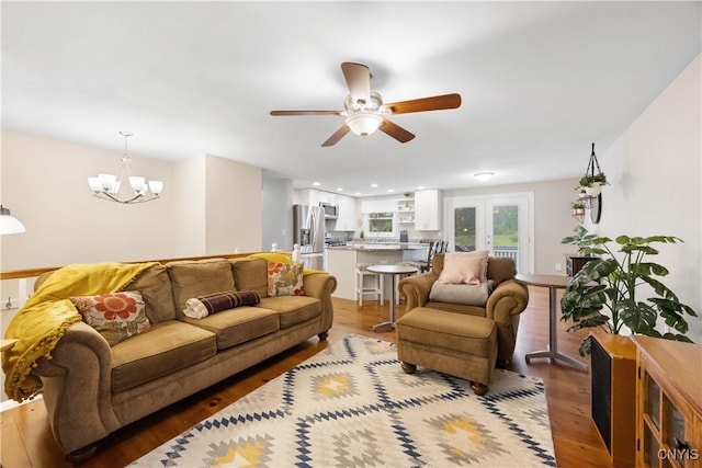 8185 Mantova Dr, Clay, NY 13041 - living area featuring a ceiling fan, wood finished floors, and a chandelier