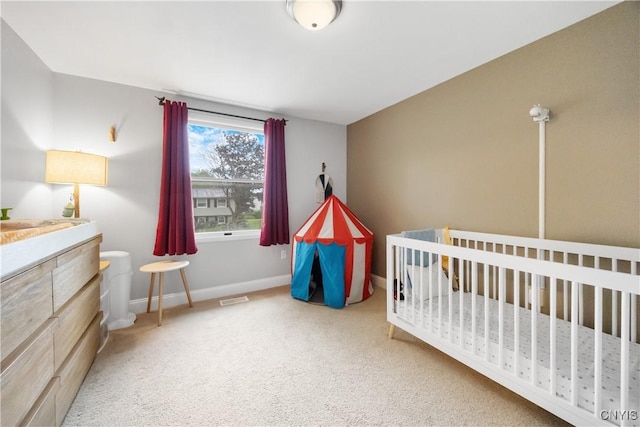 8185 Mantova Dr, Clay, NY 13041 - carpeted bedroom with baseboards and a nursery area