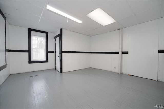 151 Oak St, Syracuse, NY 13203 - empty room with a drop ceiling and wood finished floors
