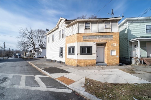 151 Oak St, Syracuse, NY 13203 - view of front facade featuring brick siding