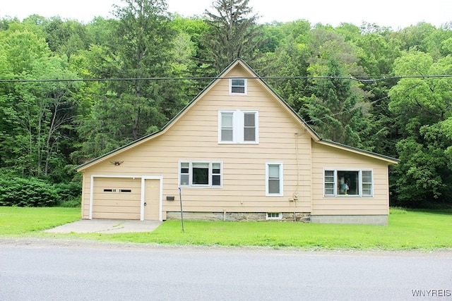 5046 Whig St, Little Valley, NY 14779 - view of front facade featuring a wooded view, a garage, a front yard, and driveway