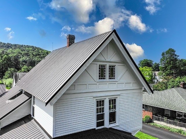 306 Broad St, Port Allegany Boro, PA 16743 - rear view of house featuring a standing seam roof, a chimney, and a metal roof