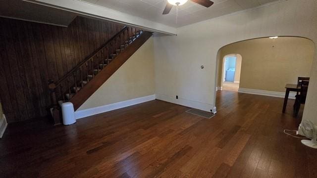 306 Broad St, Port Allegany Boro, PA 16743 - unfurnished living room featuring a ceiling fan, wood finished floors, arched walkways, and stairs