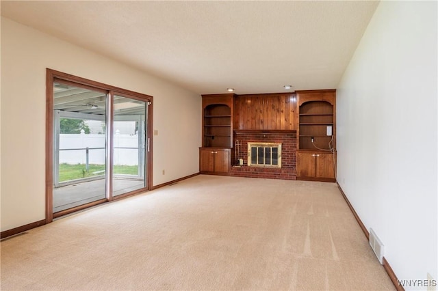 64 Bywater Dr, Amherst, NY 14068 - unfurnished living room with light colored carpet and a brick fireplace
