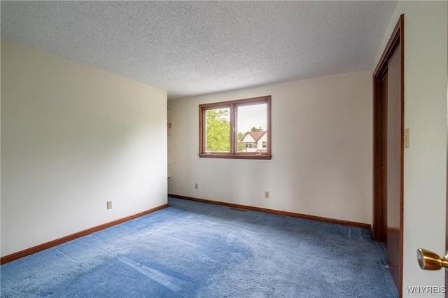 64 Bywater Dr, Amherst, NY 14068 - spare room featuring carpet floors and a textured ceiling