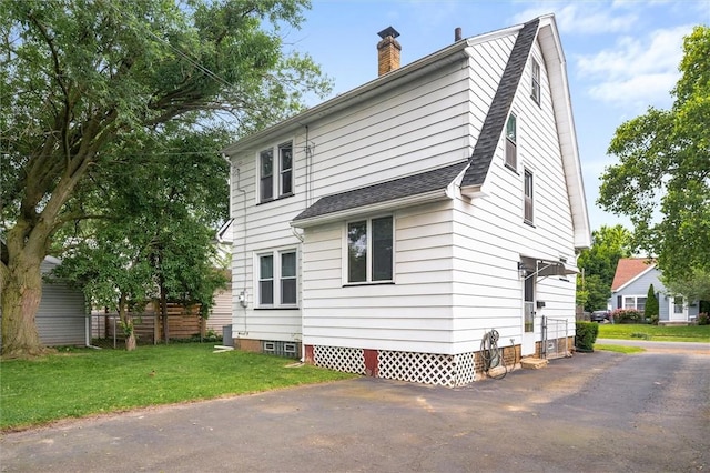 199 Brett Rd, Irondequoit, NY 14609 - rear view of property featuring a chimney and roof with shingles
