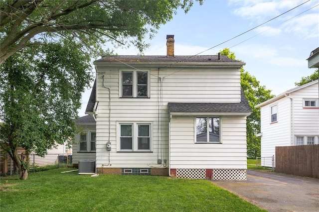199 Brett Rd, Irondequoit, NY 14609 - rear view of property with a chimney and a shingled roof