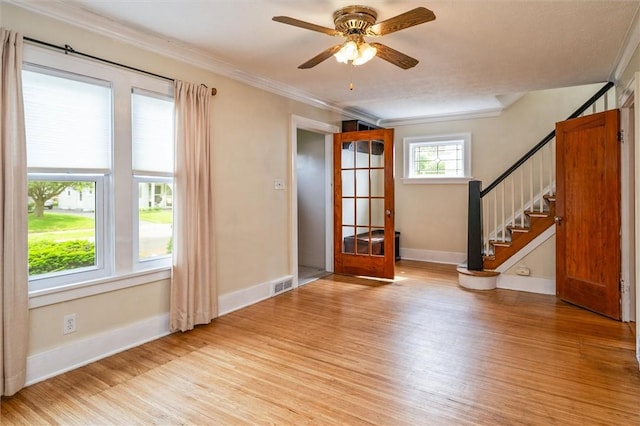 199 Brett Rd, Irondequoit, NY 14609 - entryway with light wood finished floors, stairs, ceiling fan, and ornamental molding