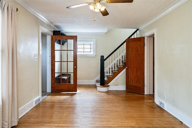 199 Brett Rd, Irondequoit, NY 14609 - entryway with wood finished floors, crown molding, a ceiling fan, and stairway
