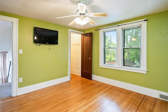 199 Brett Rd, Irondequoit, NY 14609 - empty room with light wood finished floors and ceiling fan
