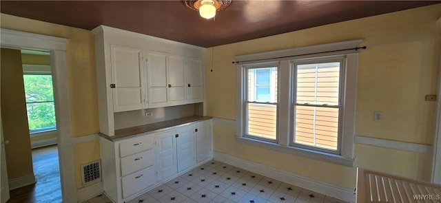129 Albert Ave, Buffalo, NY 14207 - kitchen with white cabinetry and plenty of natural light