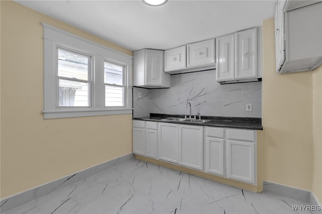 275 Olympic Ave, Buffalo, NY 14215 - kitchen with white cabinets, light marble finish floors, decorative backsplash, and dark stone countertops