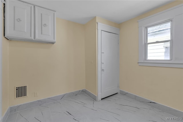 275 Olympic Ave, Buffalo, NY 14215 - unfurnished bedroom with light marble finish floors and baseboards