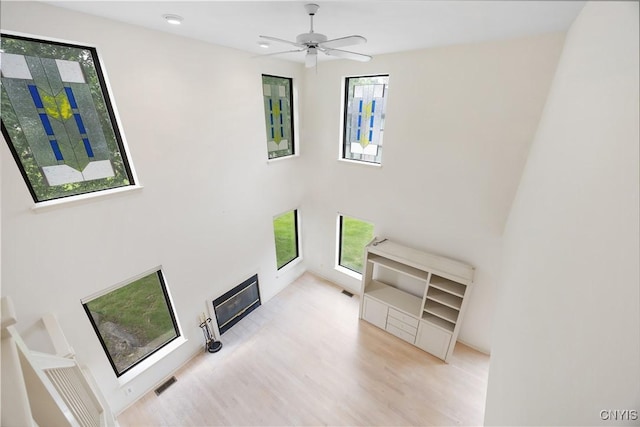 4797 Huntwood, Manlius, NY 13104 - unfurnished living room with wood finished floors and a ceiling fan