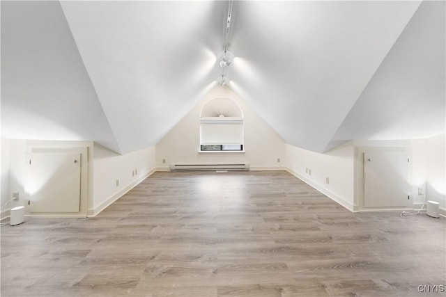 4797 Huntwood, Manlius, NY 13104 - bonus room with a baseboard heating unit, light wood-style floors, and lofted ceiling
