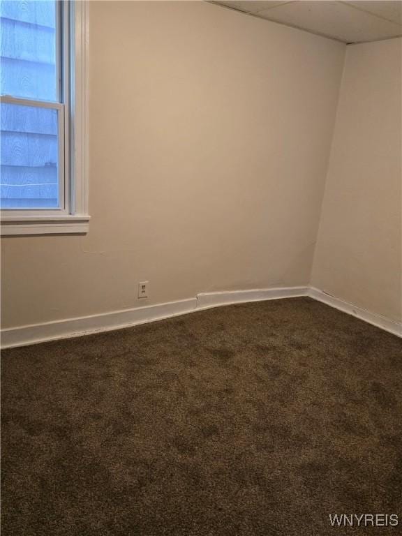1310 E Lovejoy St, Buffalo, NY 14206 - empty room featuring dark colored carpet and baseboards