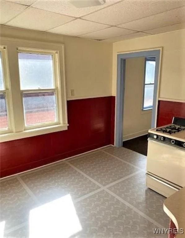 1310 E Lovejoy St, Buffalo, NY 14206 - kitchen featuring white range with gas cooktop and a paneled ceiling