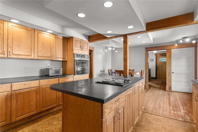 9 Orchard St, Delhi, NY 13753 - kitchen with black oven, dark countertops, recessed lighting, stovetop, and a kitchen island