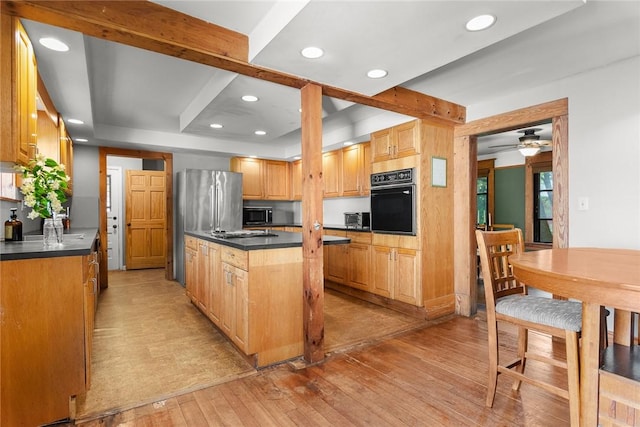 9 Orchard St, Delhi, NY 13753 - kitchen with oven, light wood-type flooring, dark countertops, stainless steel microwave, and recessed lighting