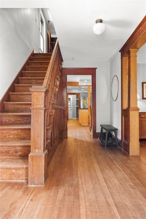 9 Orchard St, Delhi, NY 13753 - stairs featuring hardwood / wood-style floors and decorative columns
