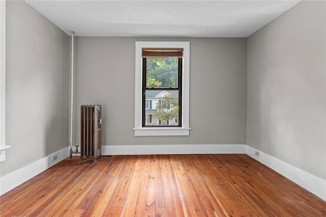 9 Orchard St, Delhi, NY 13753 - spare room featuring radiator and hardwood / wood-style floors