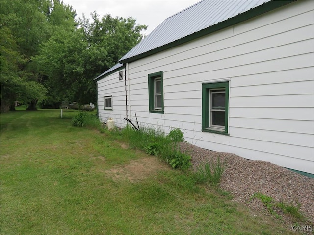 7285 State Route 812, Lowville, NY 13367 - view of home's exterior with a yard and a metal roof