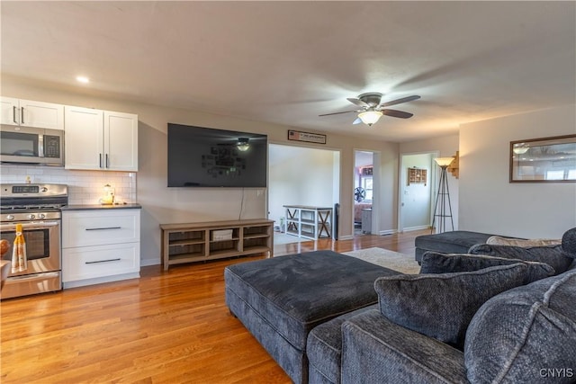 4045 E Milestrip Rd, Fenner, NY 13032 - living room featuring light wood finished floors, ceiling fan, and recessed lighting