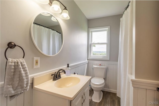 4045 E Milestrip Rd, Fenner, NY 13032 - bathroom featuring a wainscoted wall, vanity, and wood finished floors