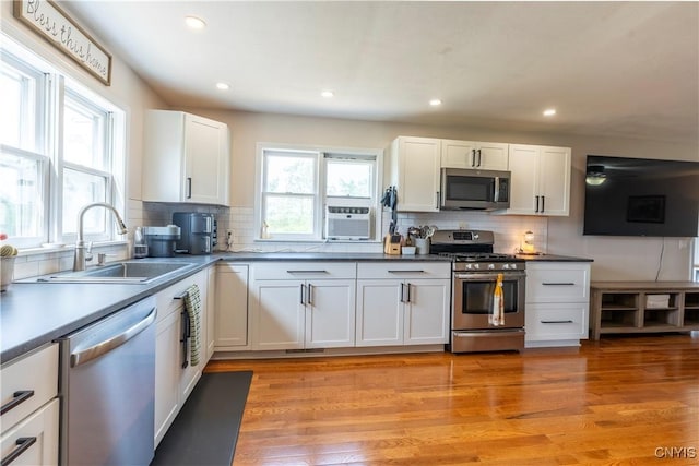 4045 E Milestrip Rd, Fenner, NY 13032 - kitchen featuring appliances with stainless steel finishes, tasteful backsplash, white cabinetry, recessed lighting, and cooling unit