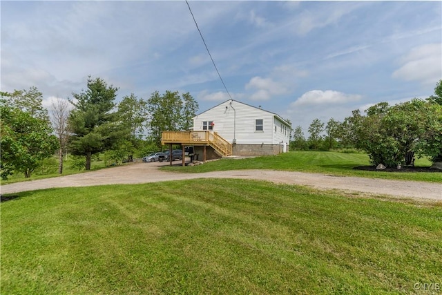 4045 E Milestrip Rd, Fenner, NY 13032 - view of home's exterior featuring driveway, a deck, a lawn, and stairway