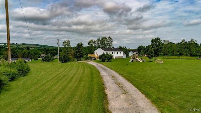 4045 E Milestrip Rd, Fenner, NY 13032 - view of front of house featuring dirt driveway and a front lawn