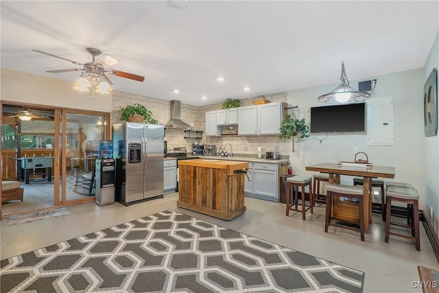 2012 Pleasant Ave, Vienna, NY 13308 - kitchen featuring stainless steel refrigerator with ice dispenser, ventilation hood, finished concrete floors, electric panel, and wooden counters