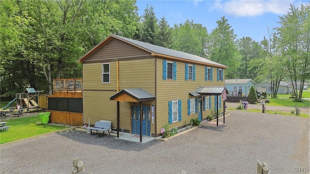2012 Pleasant Ave, Vienna, NY 13308 - view of front facade featuring gravel driveway and a playground