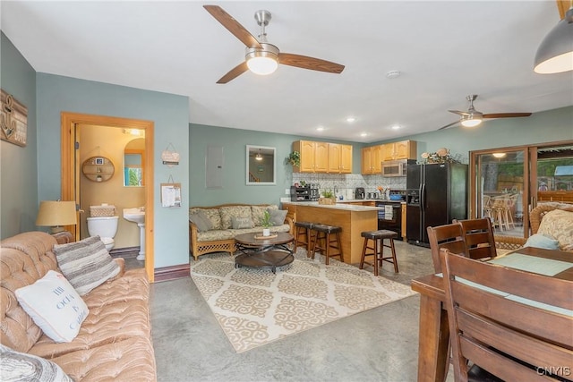 2012 Pleasant Ave, Vienna, NY 13308 - living area with a ceiling fan and finished concrete floors