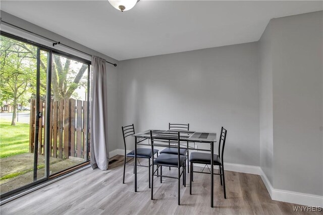 351 Charlesgate Cir, Amherst, NY 14051 - dining room featuring baseboards and wood finished floors