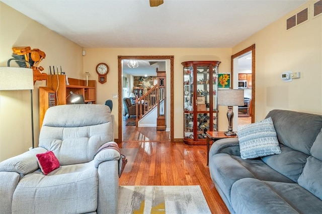 99 Old English Dr, Greece, NY 14616 - living area with wood finished floors and stairway
