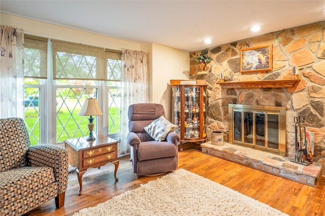 99 Old English Dr, Greece, NY 14616 - living area with wood finished floors and a fireplace