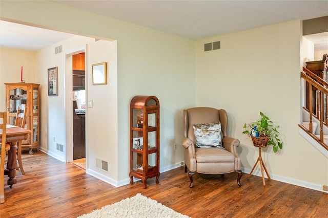 99 Old English Dr, Greece, NY 14616 - sitting room with wood finished floors and stairs