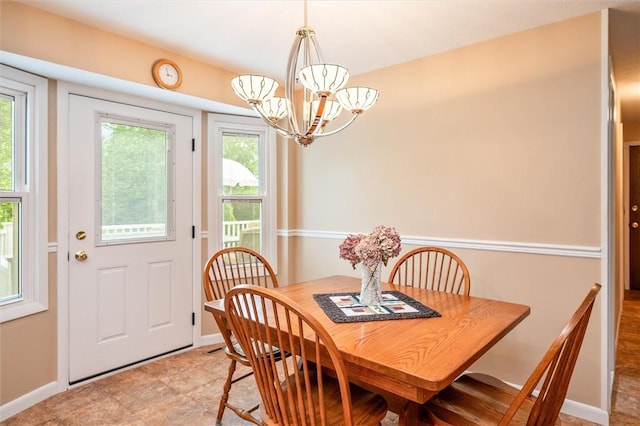 99 Old English Dr, Greece, NY 14616 - dining area with a chandelier and baseboards
