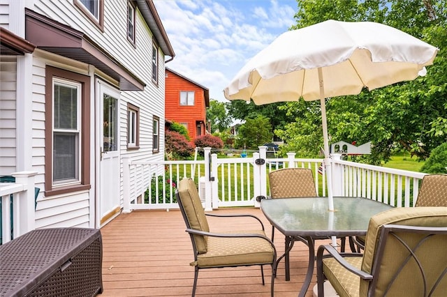 99 Old English Dr, Greece, NY 14616 - wooden deck featuring outdoor dining space and a lawn