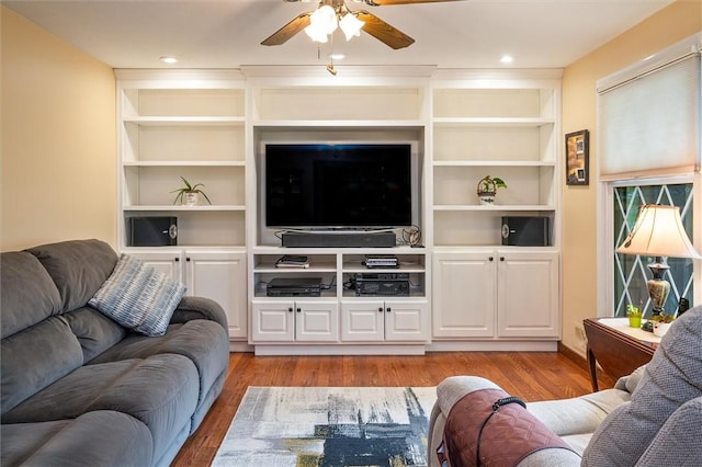 99 Old English Dr, Greece, NY 14616 - living area featuring light wood-style floors, ceiling fan, and built in features